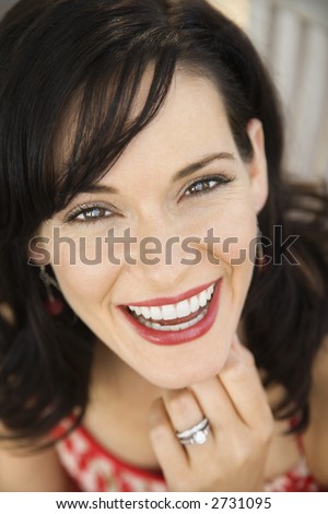 stock photo Midadult Caucasian woman smiling wearing wedding ring