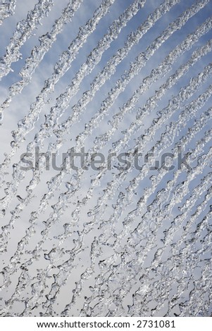 Abstract streams of water from fountain.