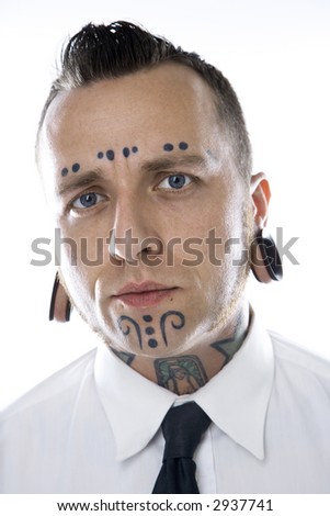 stock photo Caucasian midadult man with tattoos and piercings wearing 