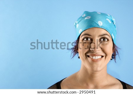 stock photo : Hispanic mid-adult woman wearing bandana on head and smiling.