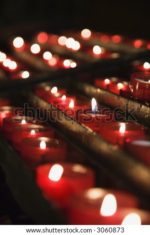 Group of lit church candles in Lisbon, Portugal.