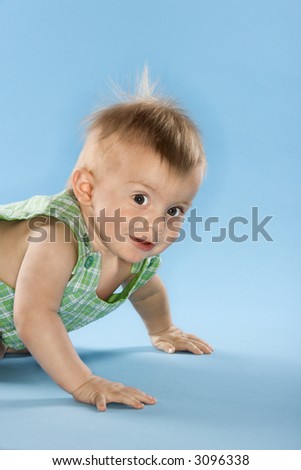 Portrait of Caucasian male child crawling.
