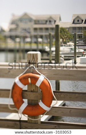 Life preserver hanging on dock on Bald Head Island, North Carolina.