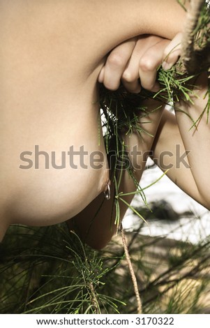 stock photo : Close up of young Caucasian breast with pierced nipple.