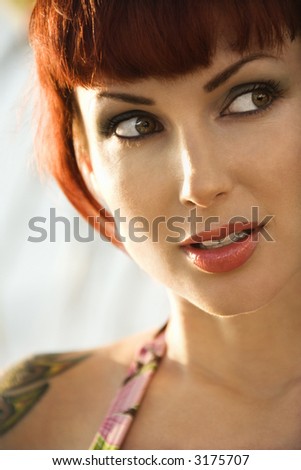 Close up portrait of sexy Caucasian redheaded woman in bikini in Maui, Hawaii, USA.