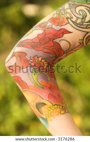 stock photo Close up of floral tattoo on arm of Caucasian woman