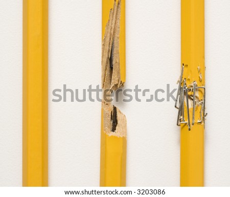 Whole pencil, broken pencil and stapled together pencil lined up against white background.