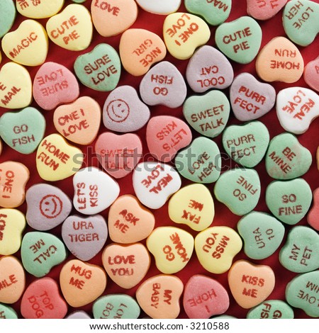 Pictures  Quotes  on Colorful Candy Hearts With Sayings On Them Arranged On Red Background