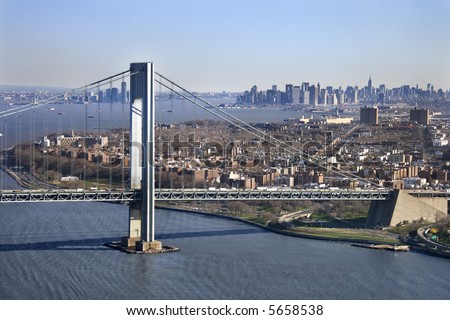 stock-photo-aerial-view-of-new-york-city-s-verrazano-narrow-s-bridge-with-manhattan-skyline-5658538.jpg