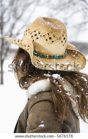 long hair back view. stock photo : Back view of brunette woman with long hair wearing straw 
