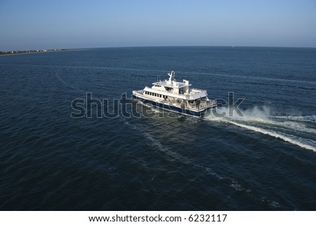 Aerial view of passenger ferry boat in open water near Bald Head Island, North Carolina.