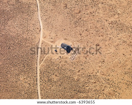 Aerial of house in remote area of Arizona desert.