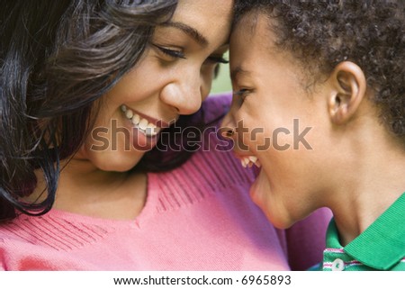 Close up of happy smiling mother and young son.