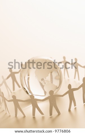 pictures of people holding hands around. around globe holding hands