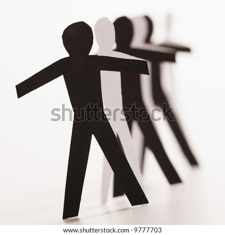 stock photo : Black and white cutout paper people standing in line together.