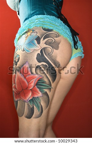 stock photo Closeup of womans tattooed leg