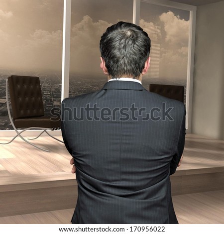 young businessman standing with his back