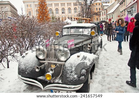 RIGA, LATVIA - January 4: retro car Conan Doyle\'s birthday January 4, 2015 Sherlock Holmes on the streets of Riga, Latvia