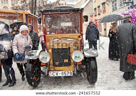 RIGA, LATVIA - January 4: Retro car and book character Conan Doyle\'s birthday January 4, 2015  Sherlock Holmes on the streets of Riga, Latvia