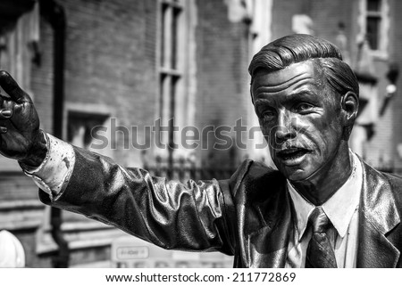 LONDON, UK - MAY 17, 2014: Photo of Taxi, a statue by American sculptor J. Seward Johnson Jr., situated in John Carpenter Street in London. Processed in B&W.