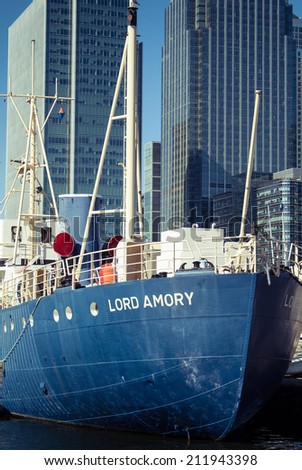 LONDON, UK - MARCH 16, 2014: Photo of Lord Amory, a boat parked in London\'s Canary Wharf area.
