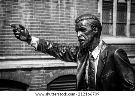 LONDON, UK - MAY 17, 2014: Photo of Taxi, a statue by American sculptor J. Seward Johnson Jr., situated in John Carpenter Street in London. Processed in B&W.