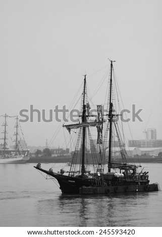 LONDON, UK - SEPTEMBER 7TH, 2014: Atyla, one of the ships taking part in the Tall Ship Festival, sailing on the River Thames in London. Processed in B&W.