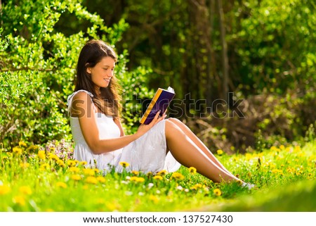 Reading a book in the spring sun