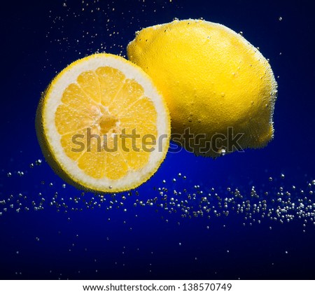 Beautiful lemon close-up photo with carbon dioxide bubbles