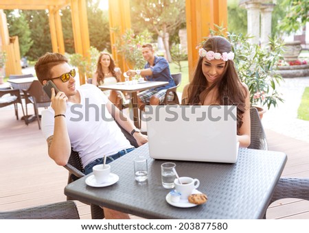 Young couple in the cafe terrace