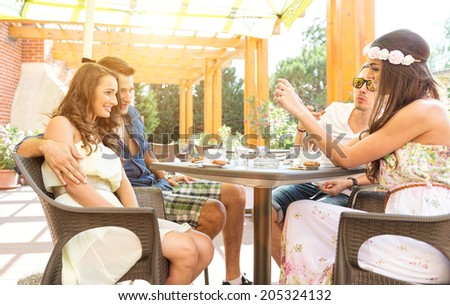 Good friends talk on the terrace, made Ã?Â¢??Ã?Â¢??a good photo with mobile phone
