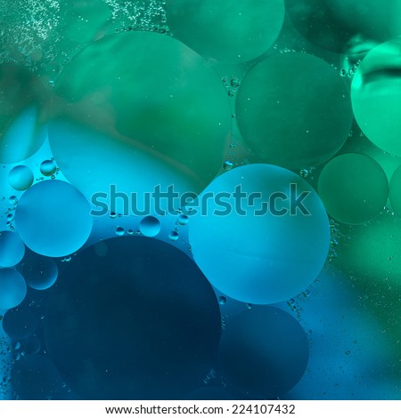 Green,blue Gradient Oil drops in the water -abstract background
