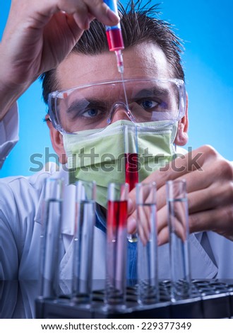 Laboratory equipment,  Man in the lab experimenting