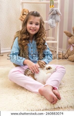 Easter - Little girl loves live rabbit