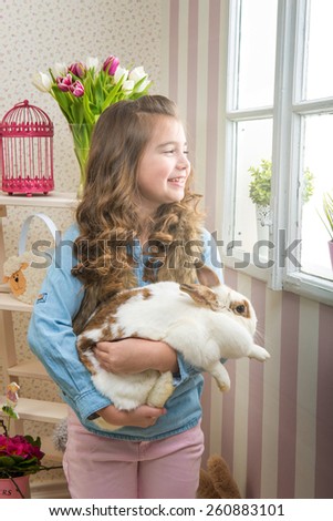 Easter - Little girl loves live rabbit