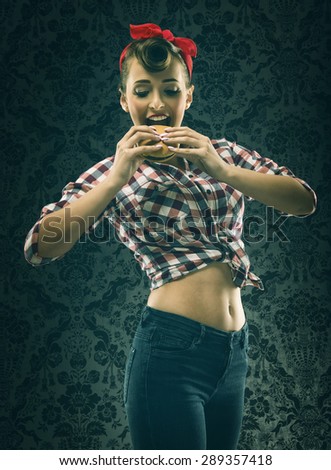 Vintage woman in old-fashioned dress, eating hamburgers