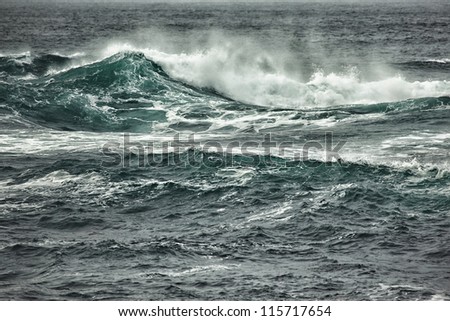 Ocean waves breaking near coastline