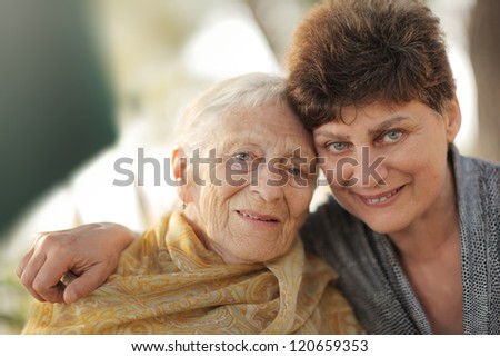 Portrait of happy old grandmother with daughter, closeup.