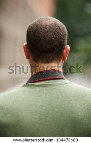 Portrait of incognito man, back view.
