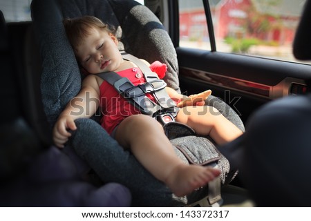 Toddler Girl Sleeping In Child Car Seat.