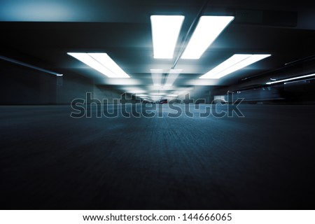 Dark Parking Garage Industrial Room Interior. Zoom Blur Perspective.