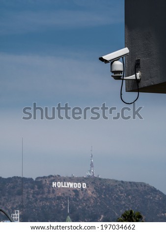 LOS ANGELES, CALIFORNIA - CIRCA 2014: Security camera overlooking famous Hollywood Sign in the background.