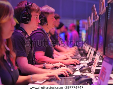 LOS ANGELES - June 17: Gamers playing demo video games at E3 2015 expo. Electronic Entertainment Expo, commonly known as E3, is an annual trade fair for the video game industry