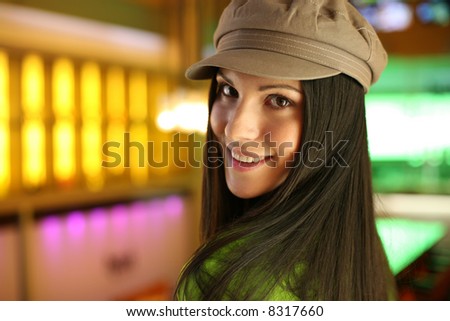 Portrait of a hip beautiful young woman in cap hat. Shallow DOF.