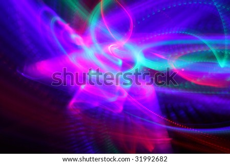 Abstract background of moving colorful lights over black