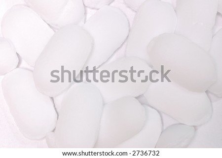 pile of water softener salt pellets on white background