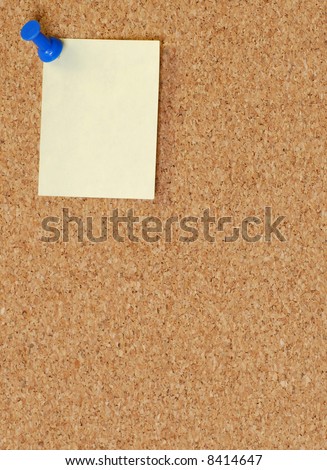 cork board with thumb tack or push pin
