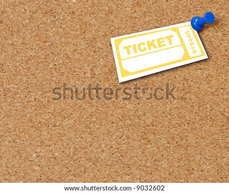 yellow ticket thumb tacked to corkboard  - room for copyspace