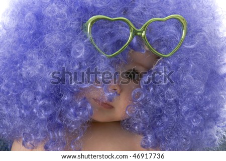 seven month old baby wearing clown wig with heart shaped glasses