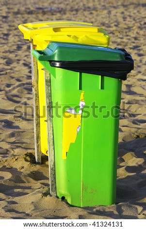 An image of selective trash containers yellow and green